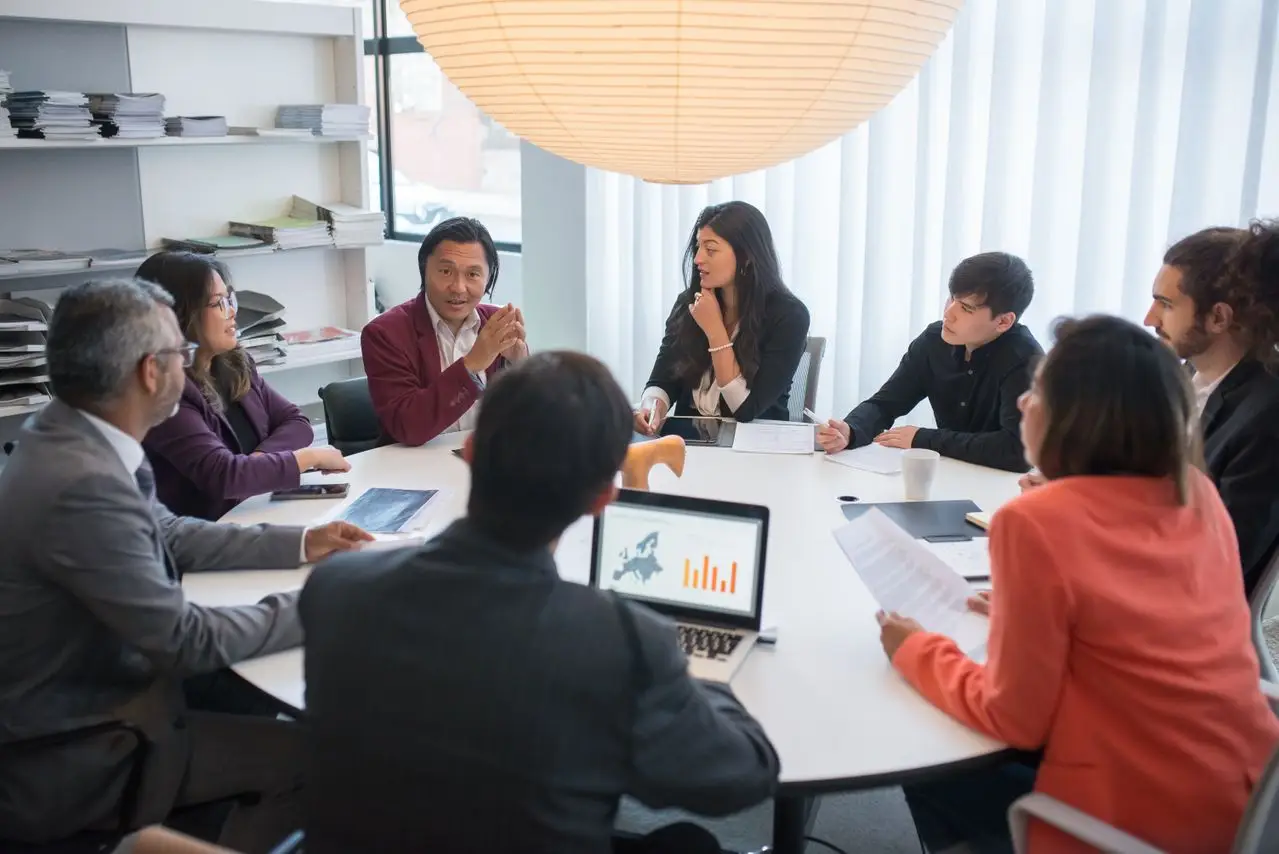 A diverse group of professionals collaborating in a modern conference room