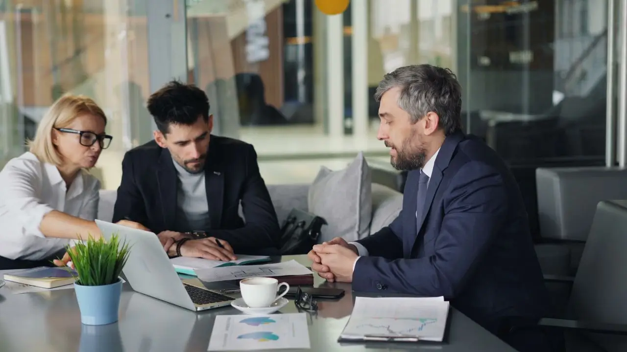 Diverse team of professionals having a business meeting in a modern office space