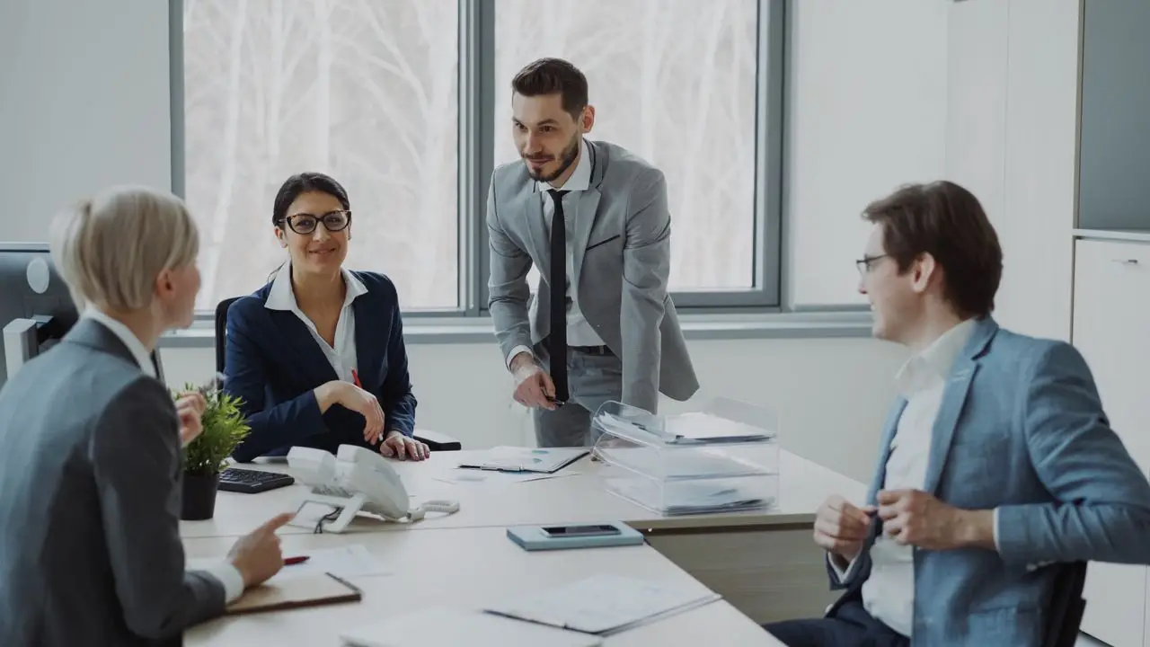 Group of professionals in a modern office setting discussing business strategies